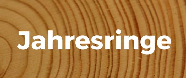 Vorstandswahl und Jahresringe Ankündigungsgrafik "Jahresringe" auf einem Holzquerschnitt mit Jahresringen der Kölner Sprechbar.